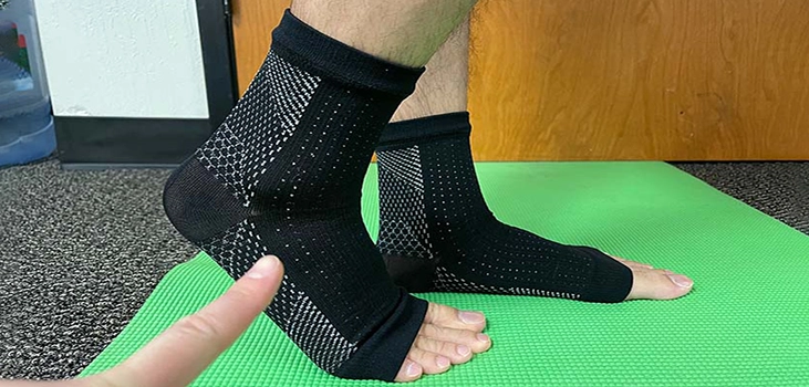 Comprex Ankle Sleeves on man's feet