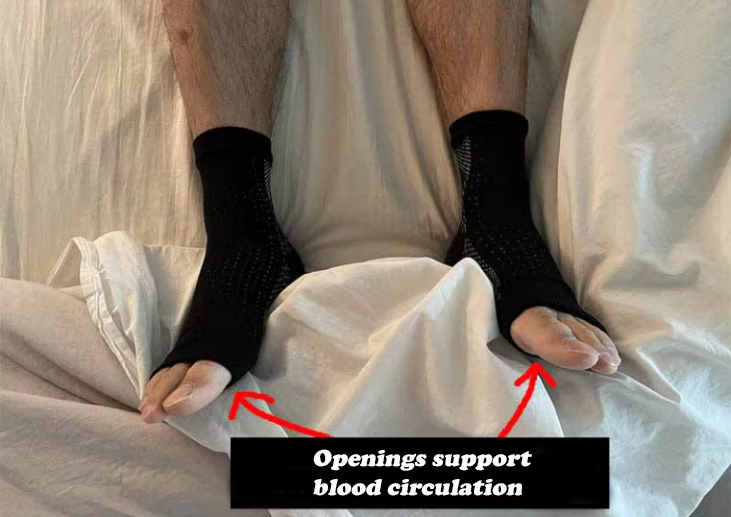 man laying in bed wearing Comprex Ankle Sleeves